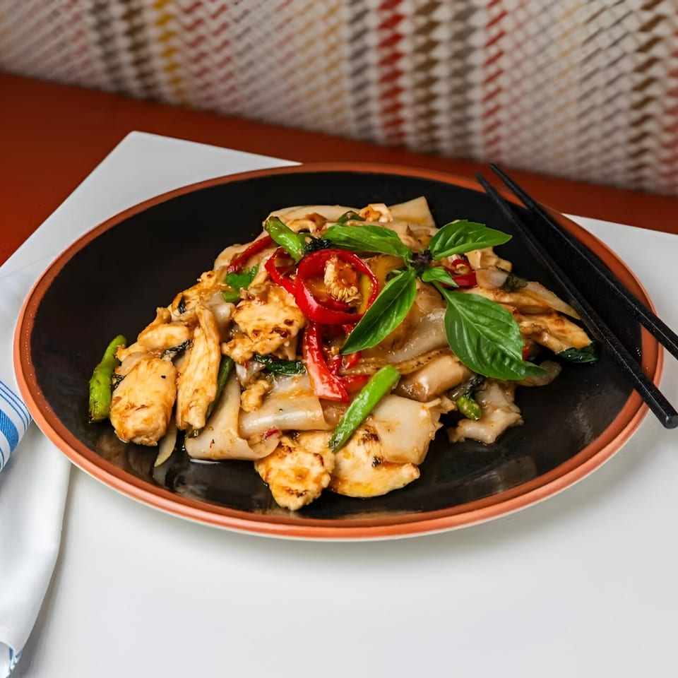 Osha Thai Kitchen's Pad See Ew with chicken, wide noodles, red peppers, and basil.